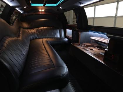 This white stretch limousine offers a beautiful, classic interior for you to enjoy 